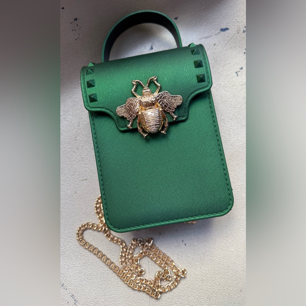 Green mini bag with gold bee accent